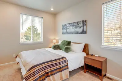 a bedroom with a bed with a teddy bear on it at Creekside Retreat Near Olde Town Arvada in Arvada