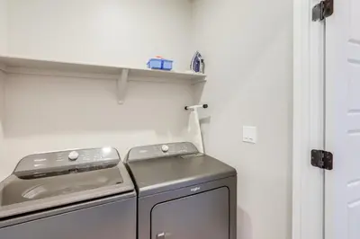 a small kitchen with a stove and a dishwasher at Creekside Retreat Near Olde Town Arvada in Arvada