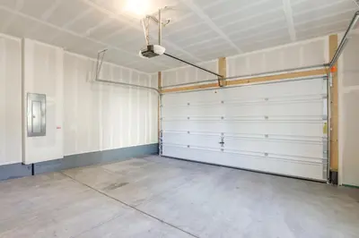 an empty garage with white walls and a ceiling at Creekside Retreat Near Olde Town Arvada in Arvada