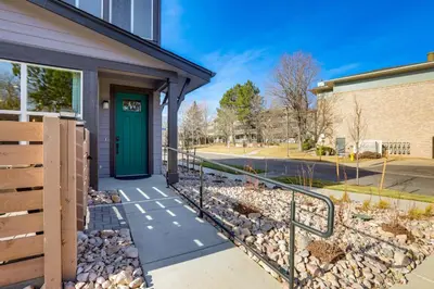 a house with a green door on a street at Creekside Retreat Near Olde Town Arvada in Arvada