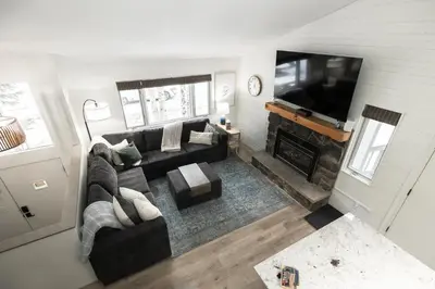 an overhead view of a living room with a couch and a television at Cozy Winter Park Ski & Bike Retreat in Winter Park