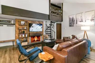 a living room with a couch and a fireplace at Wild Irishman 1029 - Keystone in Dillon