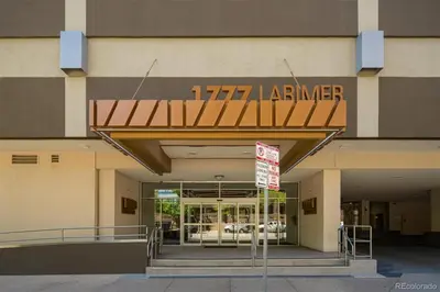 a building with a sign that reads alameda at 2BR Condo in Heart of LoDo with Great Amenities in Denver