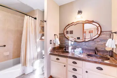 a bathroom with two sinks and a mirror at Lakepoint 807C - Frisco in Frisco