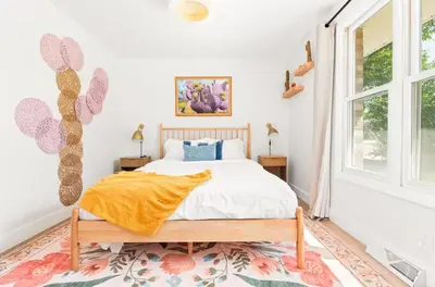 a bedroom with a bed and a window at Fam Retreat, Hot Tub, BBQ, Ski, Game Room, Backyard in Arvada