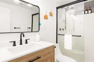 a bathroom with a sink and a shower at Fam Retreat, Hot Tub, BBQ, Ski, Game Room, Backyard in Arvada