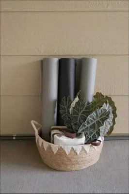 a basket with a plant sitting on a wall at Fam Retreat, Hot Tub, BBQ, Ski, Game Room, Backyard in Arvada