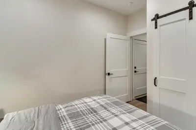 a bedroom with a bed and a closet at 4 Mi to Granby Ranch Gem with Balcony and Mtn Views! in Granby