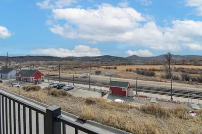 a view of a parking lot with a red building at 4 Mi to Granby Ranch Gem with Balcony and Mtn Views! in Granby
