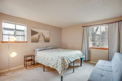 a bedroom with a bed and a couch at 3 Mi to Buckley Convenient Condo in Aurora in Aurora