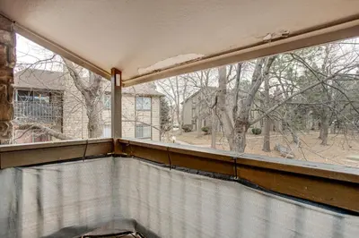 an empty balcony with a large window in a house at 3 Mi to Buckley Convenient Condo in Aurora in Aurora