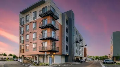 an apartment building with balconies on a street at Landing Chic Studio in Fort Collins in Fort Collins