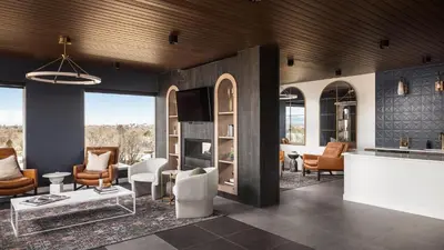 a living room with chairs and a table at Landing Stunning Studio Rooftop Lounge Gym in Englewood