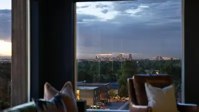 a view of a city from a window at Landing Stunning Studio Rooftop Lounge Gym in Englewood