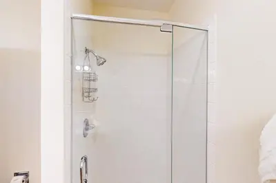 a shower with a glass door in a bathroom at Tenmile Vista Retreat in Silverthorne