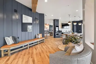 a living room with a couch and a kitchen at Landing Incredible 1BD Gym Clubhouse in Littleton