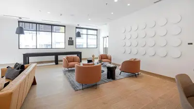a living room with a couch and chairs and a piano at Landing Beautiful 1BD Gym Rooftop Lounge in Denver