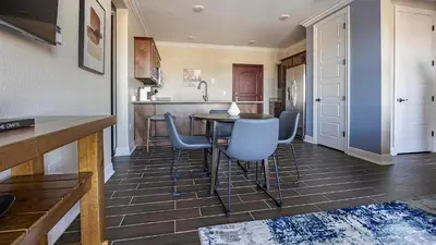 a kitchen with a table and chairs in a room at Landing Amazing 2BD Pool Clubhouse in Loveland