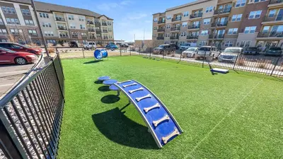 a playground in front of a large building at Landing Amazing 2BD Pool Clubhouse in Loveland