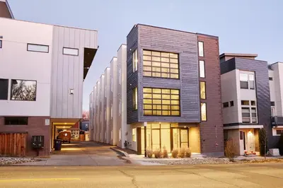 a group of buildings on a street at Landing Modern Studio Rooftop Lounge in Denver