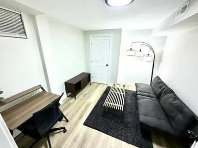 a living room with a couch and a piano at Family Fun Hub - Games, Hot Tub, Putting Greens in Centennial