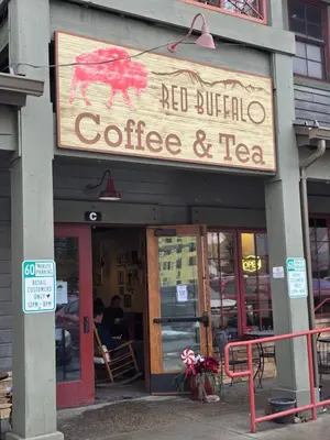 a building with a sign for a coffee and tea at 4th Street Alpine Loft - New - Central Ski Hub - King Bed, Garage Parking, Hot Tub, Great Location in Silverthorne