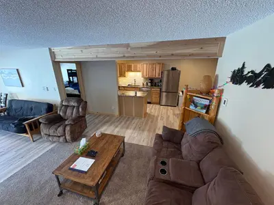 a living room with a couch and a table at Summit Mountain Escape in Silverthorne