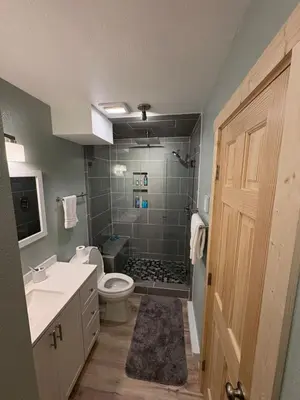 a bathroom with a toilet and a sink and a shower at Summit Mountain Escape in Silverthorne