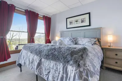 a bedroom with a bed and a large window at Scenic Colorado Stay Near Casinos & Hot Springs in Black Hawk