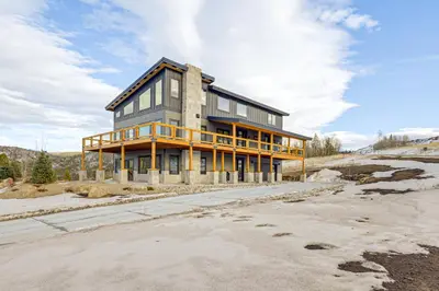 a house under construction on the side of a road at 1 Mi to Granby Ranch Luxe Home with Mtn Views! in Granby