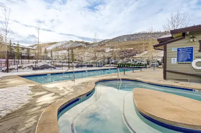 a swimming pool at a resort in the snow at 1 Mi to Granby Ranch Luxe Home with Mtn Views! in Granby