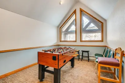 a game room with a chess board on a table at Walk to Ski Lift and Hot Tubs! Mtn-View Keystone Gem in Keystone