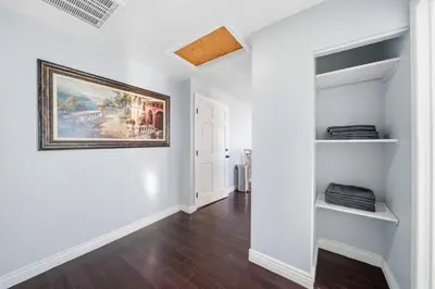 a room with white walls and a painting on the wall at Near Downtow 3Bed 2 Bath in Denver Explore Colorado in Denver