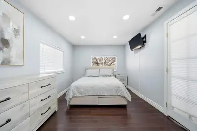 a bedroom with a bed and a tv in it at Near Downtow 3Bed 2 Bath in Denver Explore Colorado in Denver