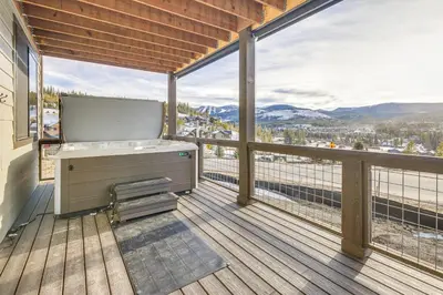 a balcony with a sink and a large window at Hot Tub and Amazing Views Luxury Winter Park Haven! in Winter Park