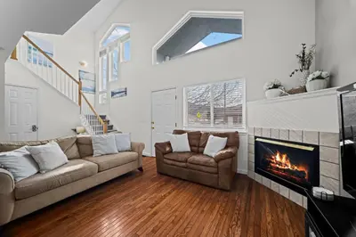 a living room with two couches and a fireplace at Golden View Townhouse - Walk to Downtown! in Golden