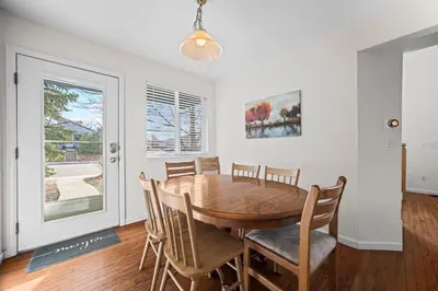 a dining room with a wooden table and chairs at Golden View Townhouse - Walk to Downtown! in Golden