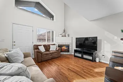 a living room with a couch and a tv and a fireplace at Golden View Townhouse - Walk to Downtown! in Golden