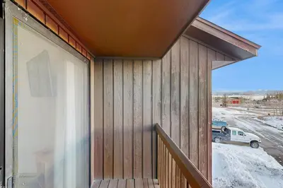 a sliding glass door on the side of a house at Next To Nature in Grand Lake