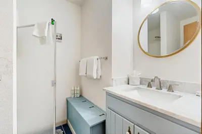 a bathroom with a sink and a mirror at Next To Nature in Grand Lake