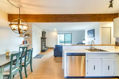 a kitchen and living room with a table and chairs at Ski, Hike and Snowmobile Mtn-View Grand Lake Gem! in Grand Lake
