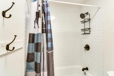 a bathroom with a shower with a shower curtain at Ski, Hike and Snowmobile Mtn-View Grand Lake Gem! in Grand Lake