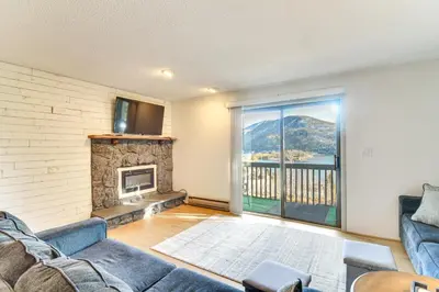 a living room with a couch and a fireplace at Ski, Hike and Snowmobile Mtn-View Grand Lake Gem! in Grand Lake
