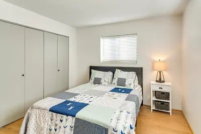 a bedroom with a bed and a night stand at Ski, Hike and Snowmobile Mtn-View Grand Lake Gem! in Grand Lake