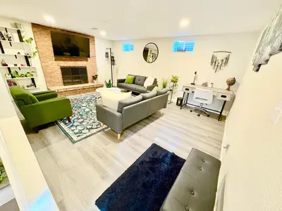 a living room with a couch and a table at Private Residence Below Basement in Thornton