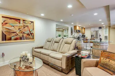 a living room with a couch and a table at Group Getaway 3 Mi to Cherry Creek State Park! in Aurora