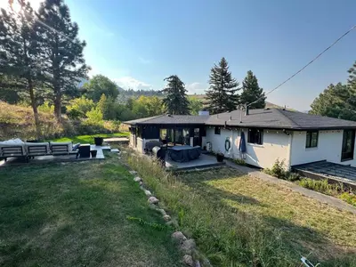 a white house with a yard and a house at Spa Getaway with Open Space Access Sauna & Hot Tub & Cold Plunge in Boulder