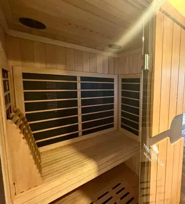 a sauna with wood paneling and a glass wall at Spa Getaway with Open Space Access Sauna & Hot Tub & Cold Plunge in Boulder
