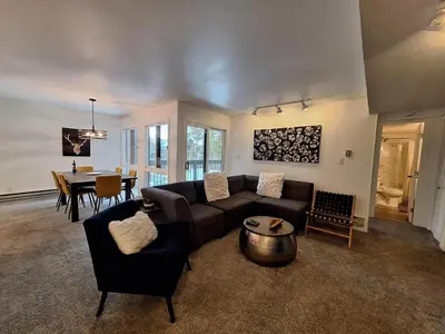 a living room with a couch and a table at Keystone Charm- Wild Irishman 3BR Mountain Escape condo in Keystone
