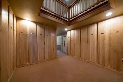a large room with wooden lockers in a building at Keystone Charm- Wild Irishman 3BR Mountain Escape condo in Keystone